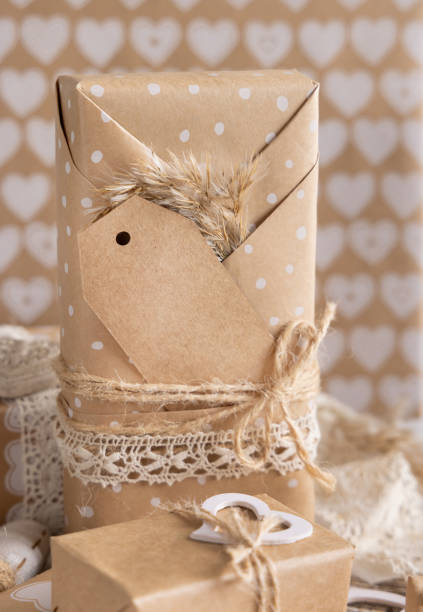 istock Valentines present with vertical blank gift tag and hearts close up, Rustic label Mockup 1364172779