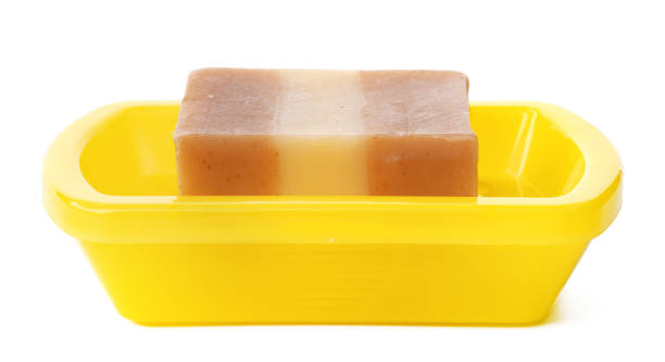istock Soap on a plastic soap dish isolated on a white background 1364175482