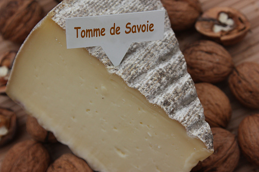 Tomme de Savoie cheese France with a name tag