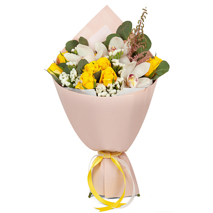 Bouquet of yellow and white flowers wrapped in paper cone with ribbon for present isolated on white background.