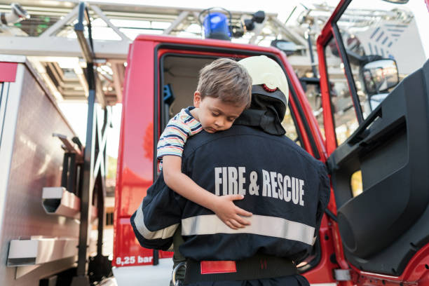 istock Fire and rescue team helping little boy 1364181043