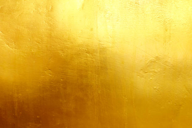 goldener hintergrund oder textur und farbverlaufsschatten - goldfarbig stock-fotos und bilder