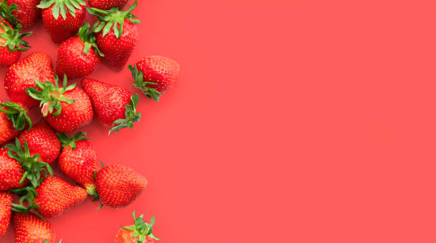 istock Ripe strawberries on pink background, summer berry, top view 1364183482