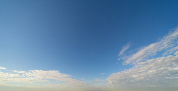 istock Clear blue sky with white fluffy clouds at noon. Day time. Abstract nature landscape background. 1364185178