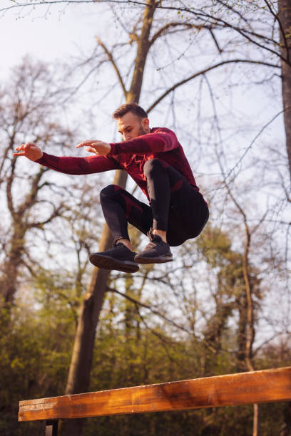 istock Man exercising in street workout park 1364186772