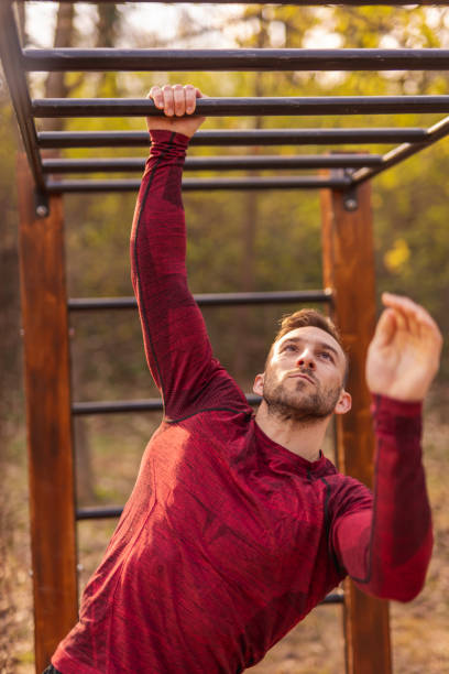 istock Man doing training session in street workout park 1364187428