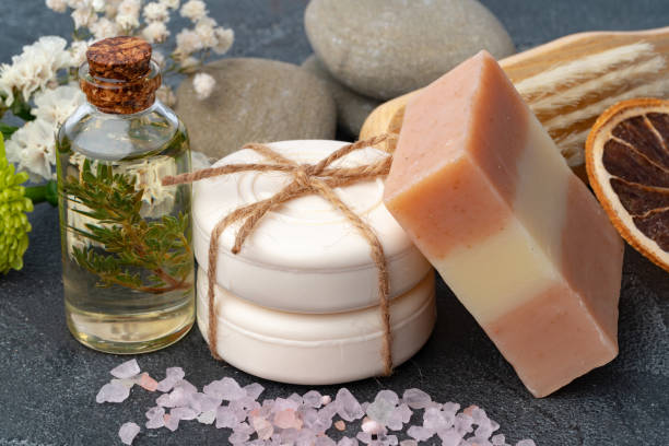 istock Skincare organic soap bars with plants extracts on gray surface. 1364189646