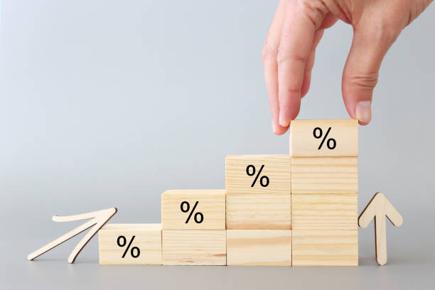 istock Wooden cubes with percentage symbol over grey background 1364191406