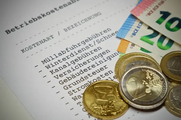 Betriebskostenabrechnung (german language) - Statement of operating costs with Euro coins and Euro banknotes. Information: The statement has been designed and printed by myself. No problems with copyright.