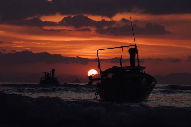 istock Sunset on tropical beach, nautical vessel on beach shore, Thailand island 1364197747