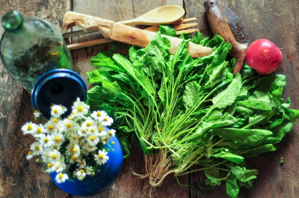 Watercress Watercress with flowers and appleapl on wooden table watercress stock pictures, royalty-free photos & images