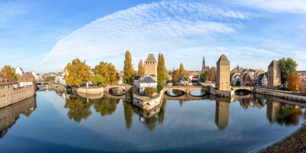 La Petite France with bridge over river Ill water tower panorama copyspace copy space Alsace in Strasbourg, France La Petite France with bridge over river Ill water tower panorama copyspace copy space Alsace in Strasbourg, France city petite france strasbourg stock pictures, royalty-free photos & images
