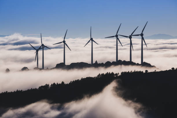 istock Wind farm at sunrise, with low fog. Navarre (Spain). 1364200759