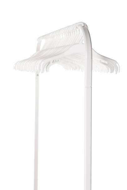 istock White plastic hangers for clothes hanging on rod from clothing rack. Isolated on white background.. 1364201549