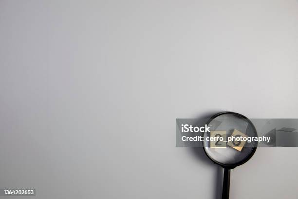 2g On Gray Background With Magnifying Glass For Covi19 Ccoronavirus Pandemic Rules Concept Top View Copy Space Stock Photo - Download Image Now