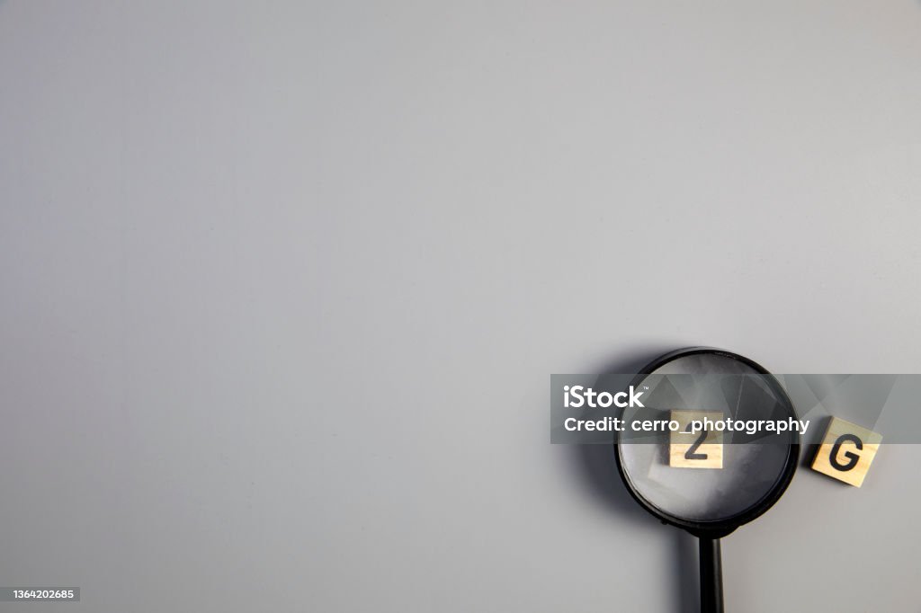 2G on gray background with magnifying glass for covi-19, ccoronavirus, pandemic rules concept top view copy space 2G on gray background with magnifying glass for covi-19, ccoronavirus, pandemic rules concept top view copy space space for text Accessibility Stock Photo