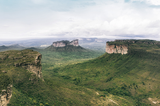 drone view over the green highlands of Chapada Diamantina in Bahia, Brazil with morro do camelo in the background