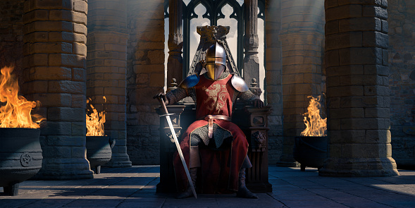 An image of a knight wearing a helmet and shoulder armour, chainmail, boots and tabard with gold prancing lion motif. The knight king sits on a wooden throne loosely holding a sword in a room in a castle with stone columns and black pots with fire.