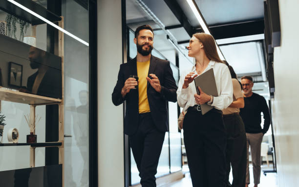 istock Young professionals having a discussion in an office 1364208045