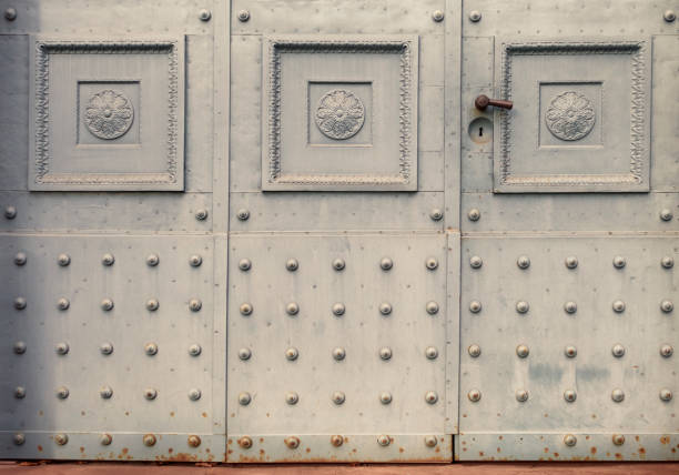 istock Ornaments and rivets on an old iron door 1364208493