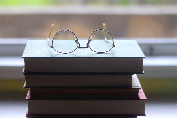 istock Hardcover Books and Reading Glasses 1364208680