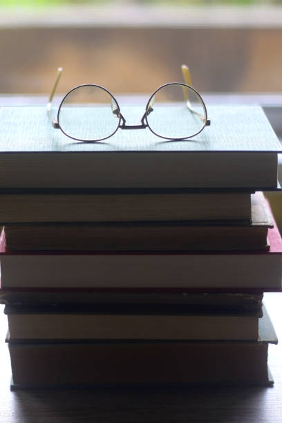 istock Hardcover Books and Reading Glasses 1364208685