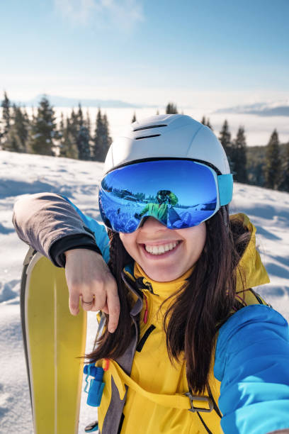 istock smiling skier woman portrait 1364209739