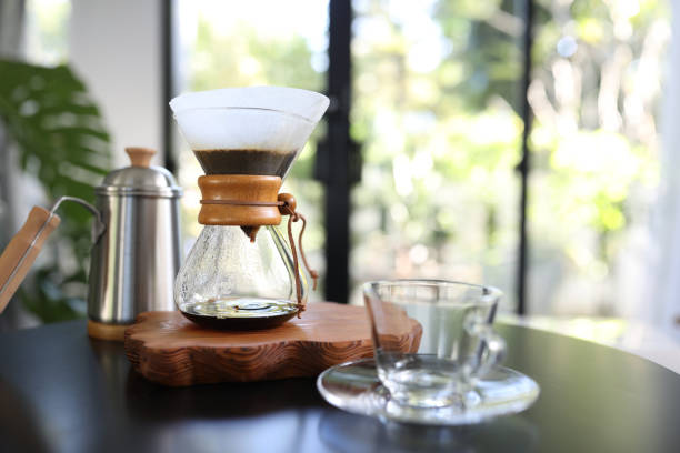 istock Coffee drip and Coffee glass cup on black table 1364209770