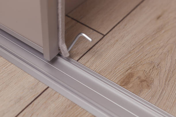 istock Adjusting of sliding wardrobe door with a hex key 1364209813