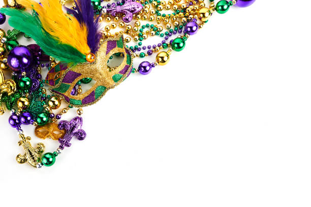 istock Frame of Mardi Gras mask and beads isolated on white background. 1364210020