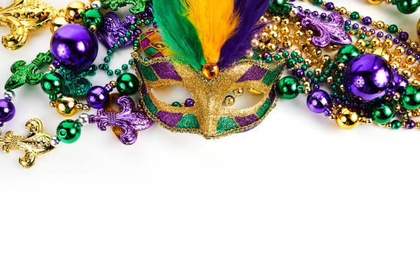 istock Frame of Mardi Gras mask and beads isolated on white background. 1364210038
