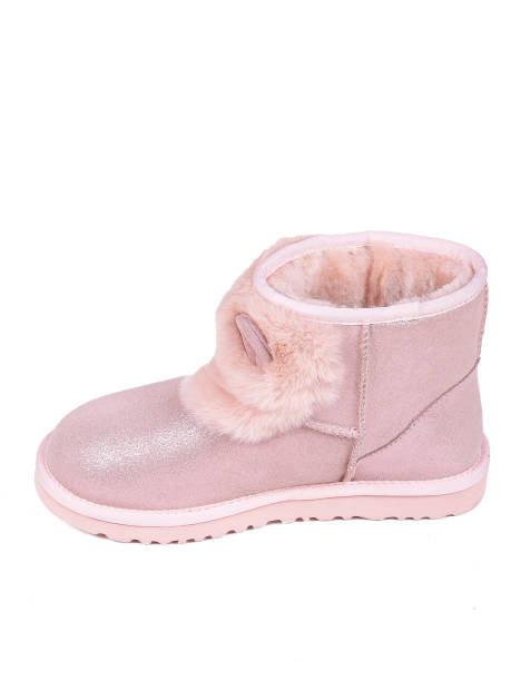 istock Pink winter woman's boots with fur on a white background 1364210388