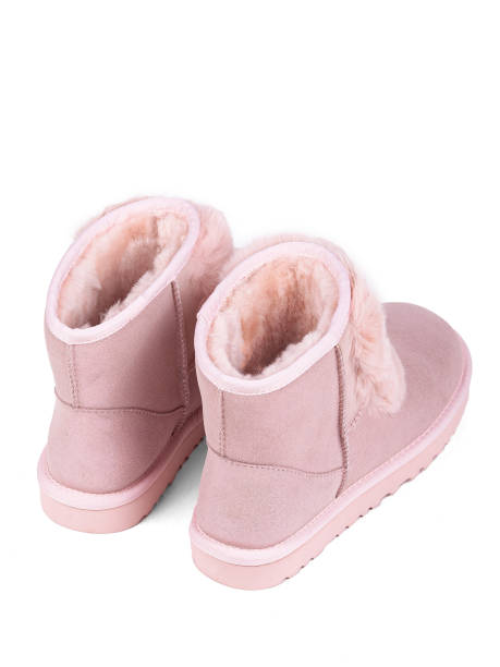 istock Pink winter woman's boots with fur on a white background 1364210397