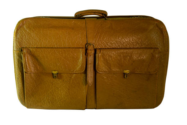 istock Old leather travel suitcase isolated on white with clipping path 1364210447