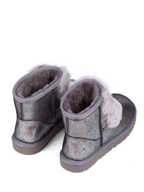 istock Silver winter woman's boots with fur on a white background 1364210502