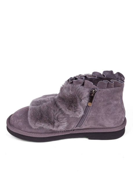 istock Purple winter woman's boots with fur on a white background 1364210519