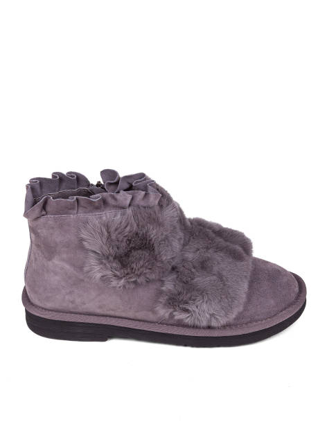 istock Purple winter woman's boots with fur on a white background 1364210527