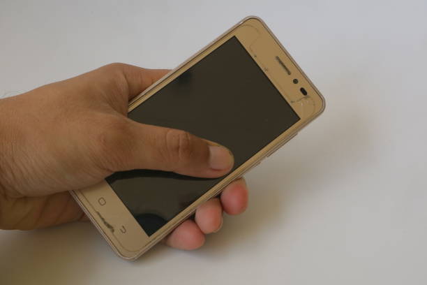 istock brown hand holding a smartphone 1364211791