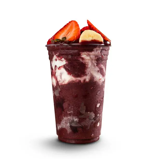Brazilian Frozen Açai Berry Ice Cream Smoothie in plastic cup with Bananas, Strawberry and Condensed Milk. isolated on white background. Front view for menu and social media