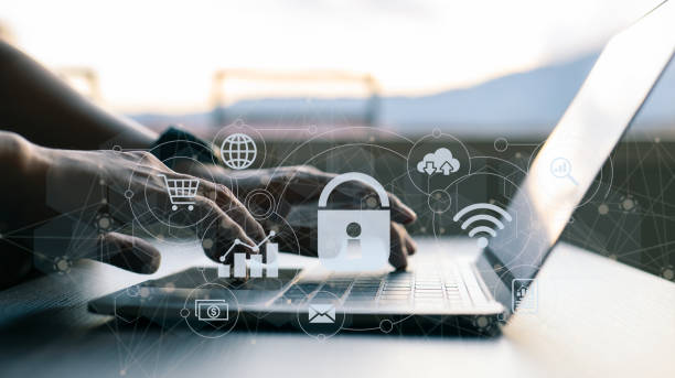 istock The concept of business, technology, the internet, and networking. On the virtual screen, a businessman working on his laptop at home selects the security symbol. 1364218214