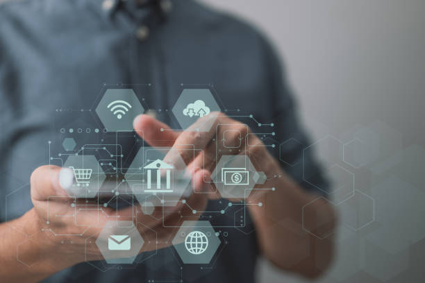 istock A man makes a payment via mobile online banking. Mobile banking network, online payment, digital marketing, and business technology are all used by business people. 1364218317