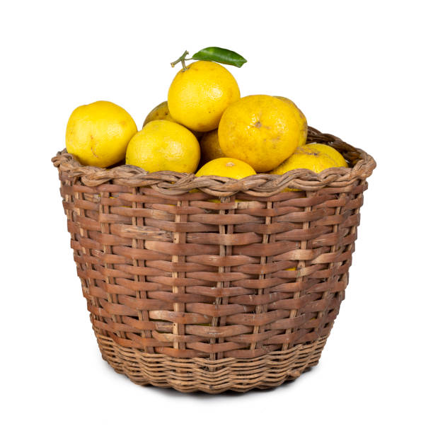 istock handmade fruit basket full of yellow oranges isolated on white 1364219695