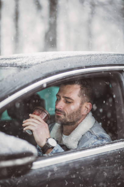 istock A handsome young man travels through a snow-covered forest 1364219703