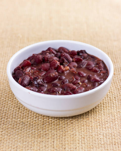 istock isolated Black beans on white plate on raw cotton dish towel. feijoada 1364223841