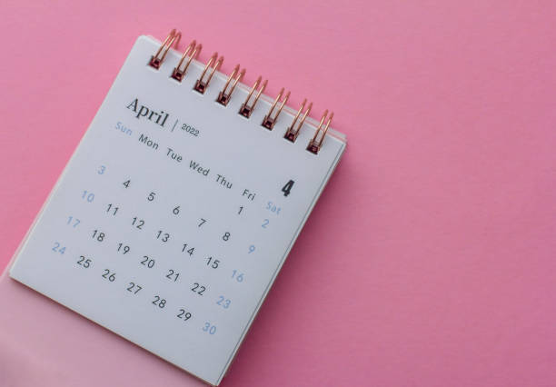 istock Calendar for April 2022 on a colored background. 1364224080