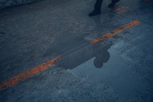 istock Walking On The Road After Rain 1364225691