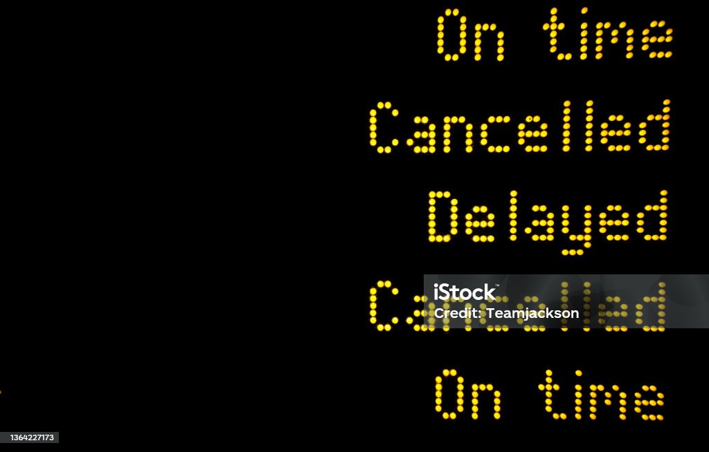 Train or plane information board with cancellation and delays A railway or airport information board informing passengers about delays and cancellations to rail, bus and plane services with copy space Train - Vehicle Stock Photo