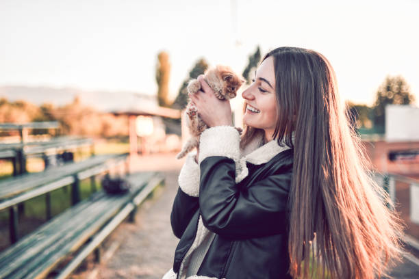 istock Beautiful Female And Her Pet Cat Outside 1364228566