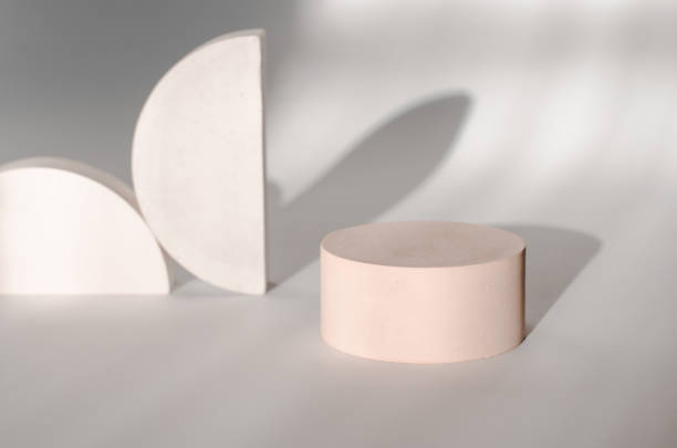 istock Round plaster podium for advertising cosmetics on a gentle light background with beautiful shadows 1364229738