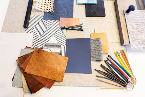 istock High angle view of various patterned fabric swatches and work tools on table in office 1364238318